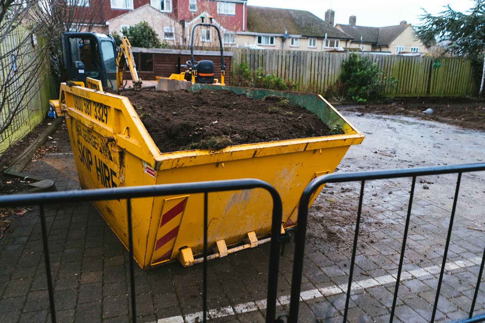 a large yellow dump truck filled with dirt